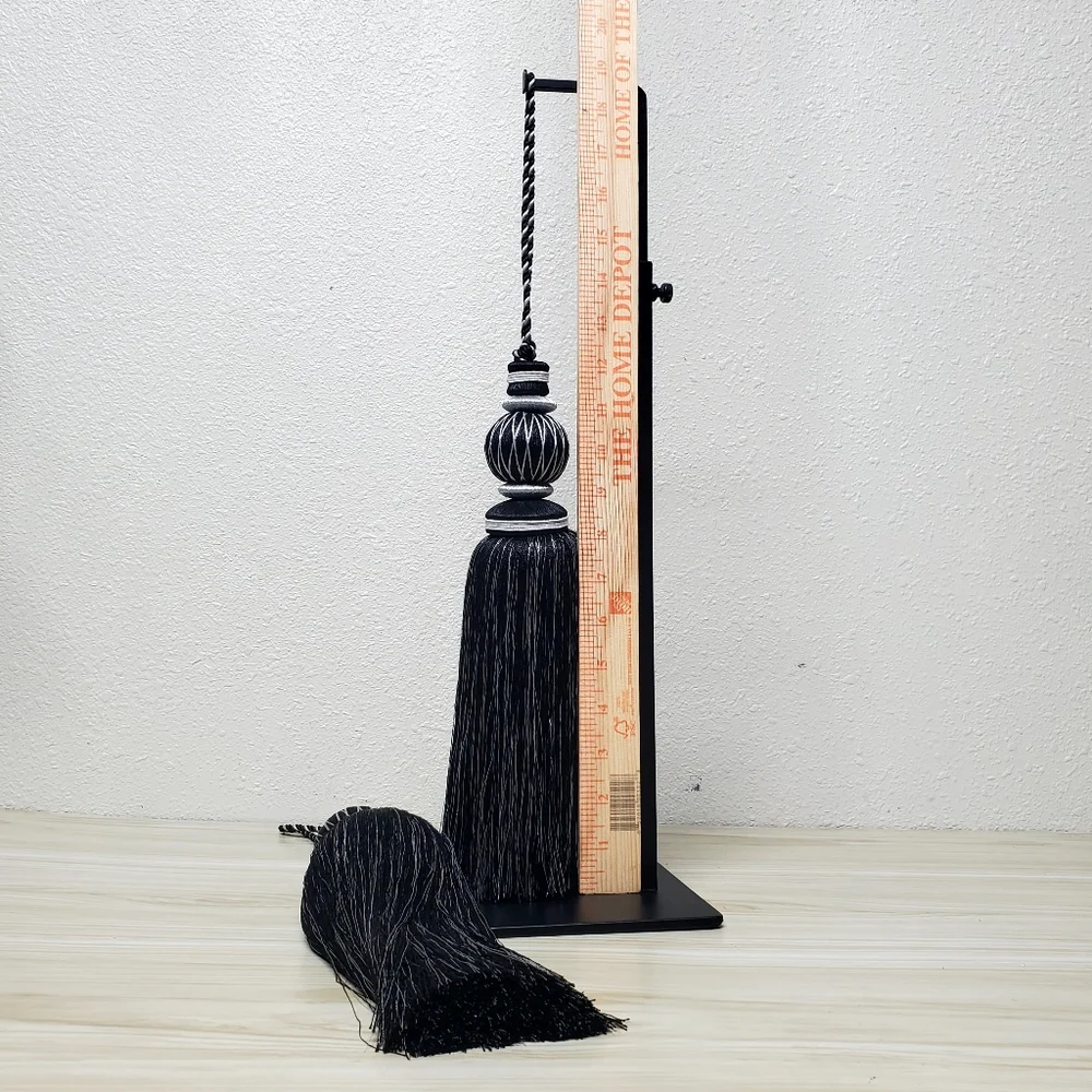 A Set of Black and Silvertone Tassel Curtain Accents with Sculptural Design, 18